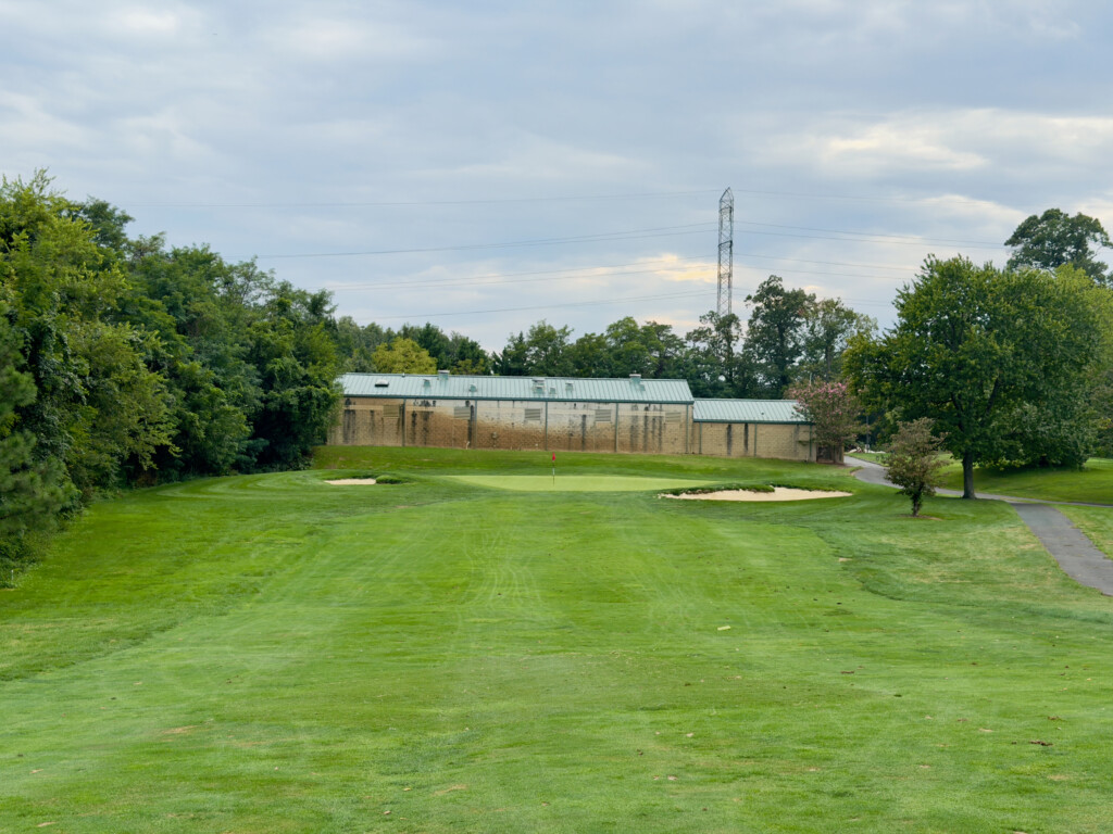 Approach view of the 8th green at Herndon Centennial Golf Course from about 130 yards, bunkers flanking the green.